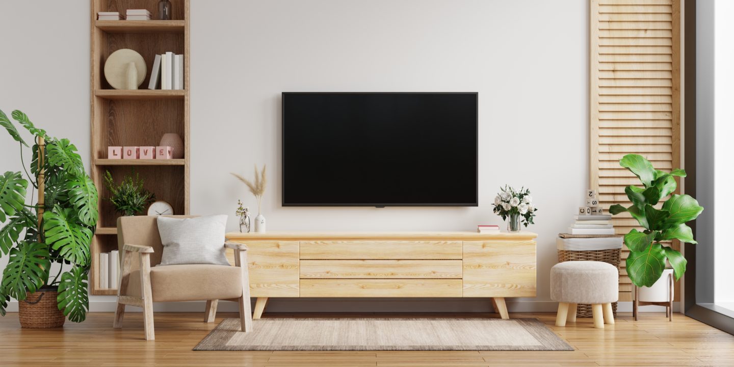 TV cabinet on the white wall in living room with armchair,minimal design.